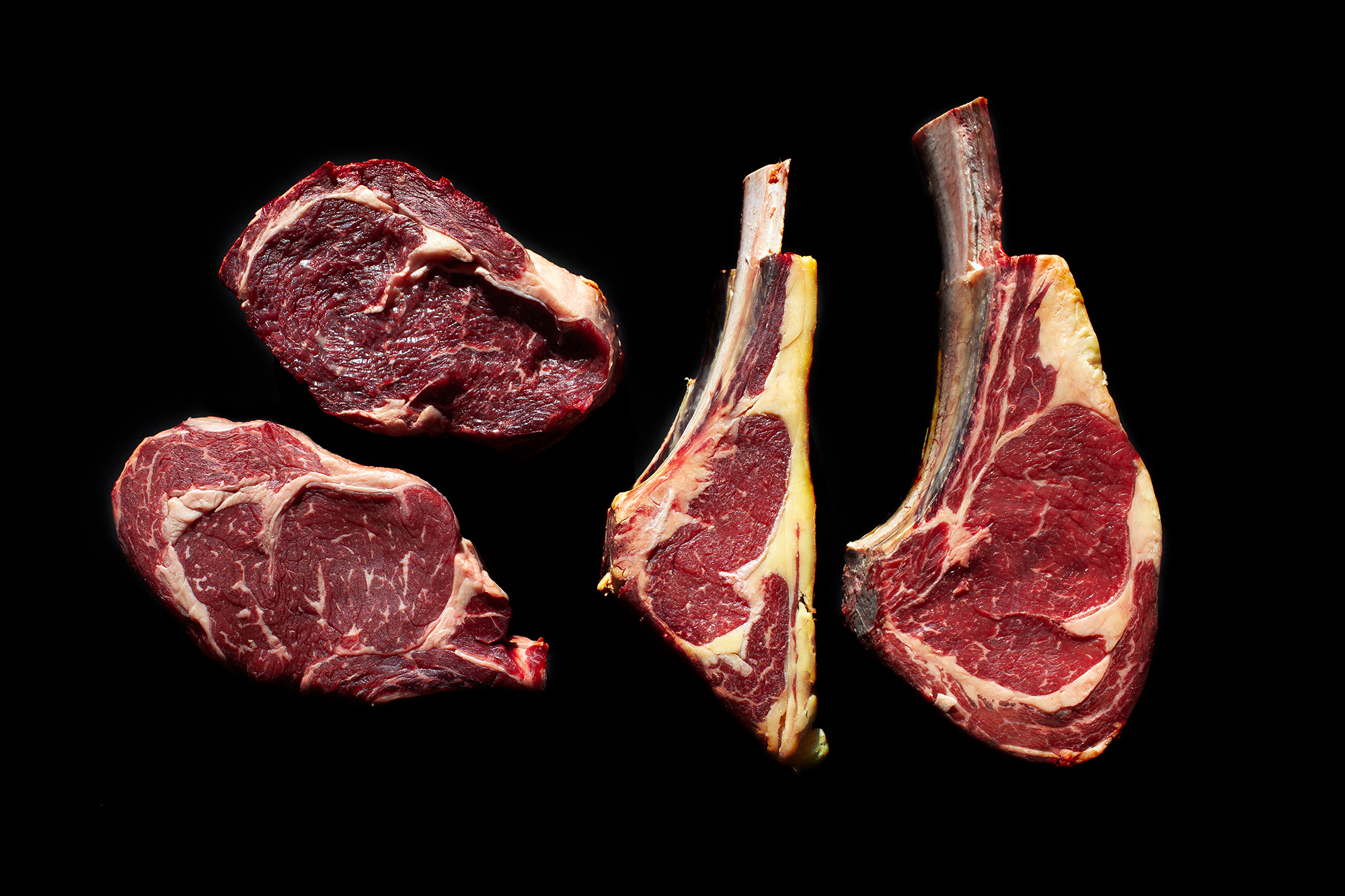 A range of retired beef and dairy cow rib eyes showcasing the variation in shape, size and colour.