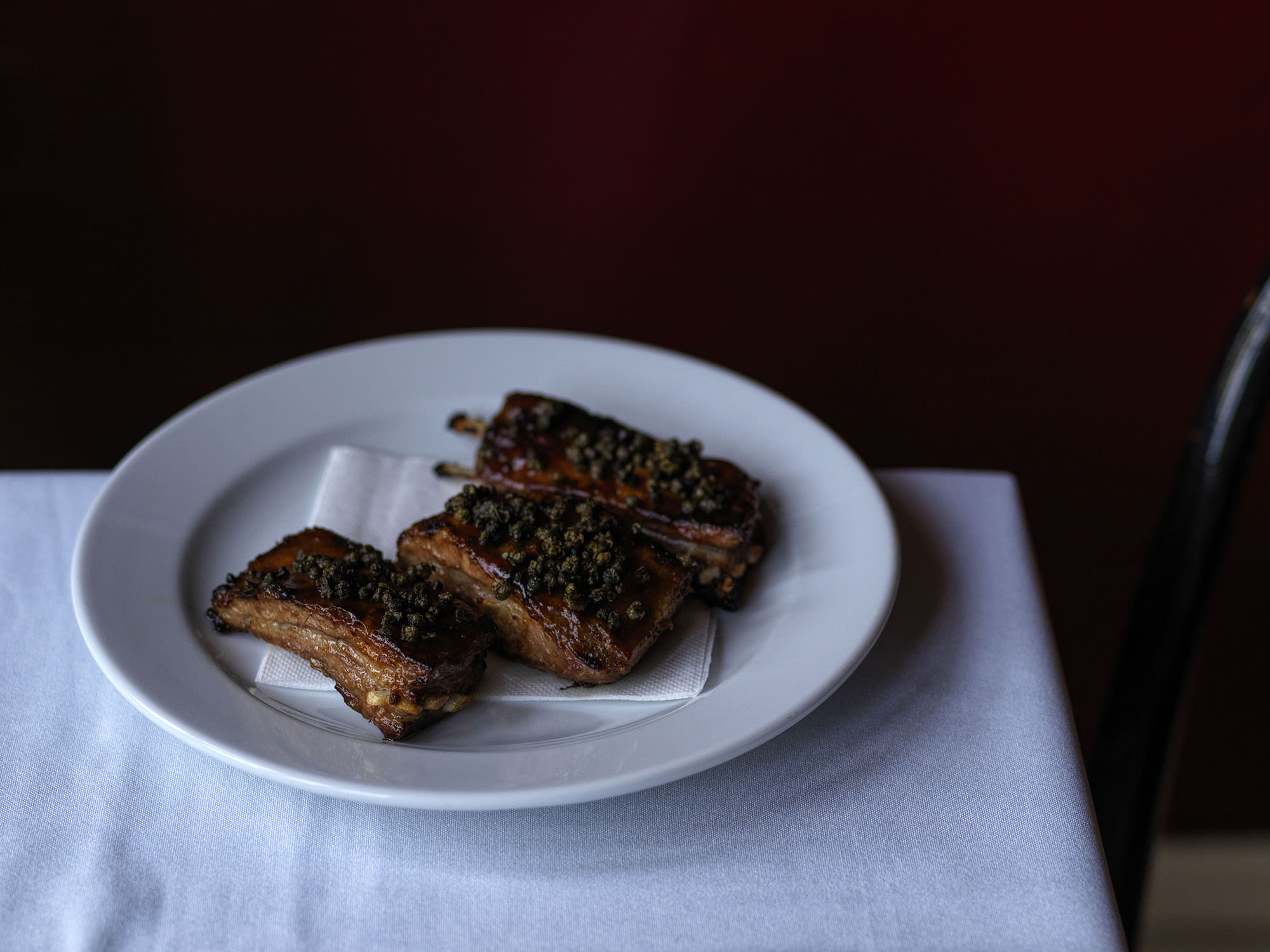 Lamb ribs glazed with salted plum in the upstairs brasserie.