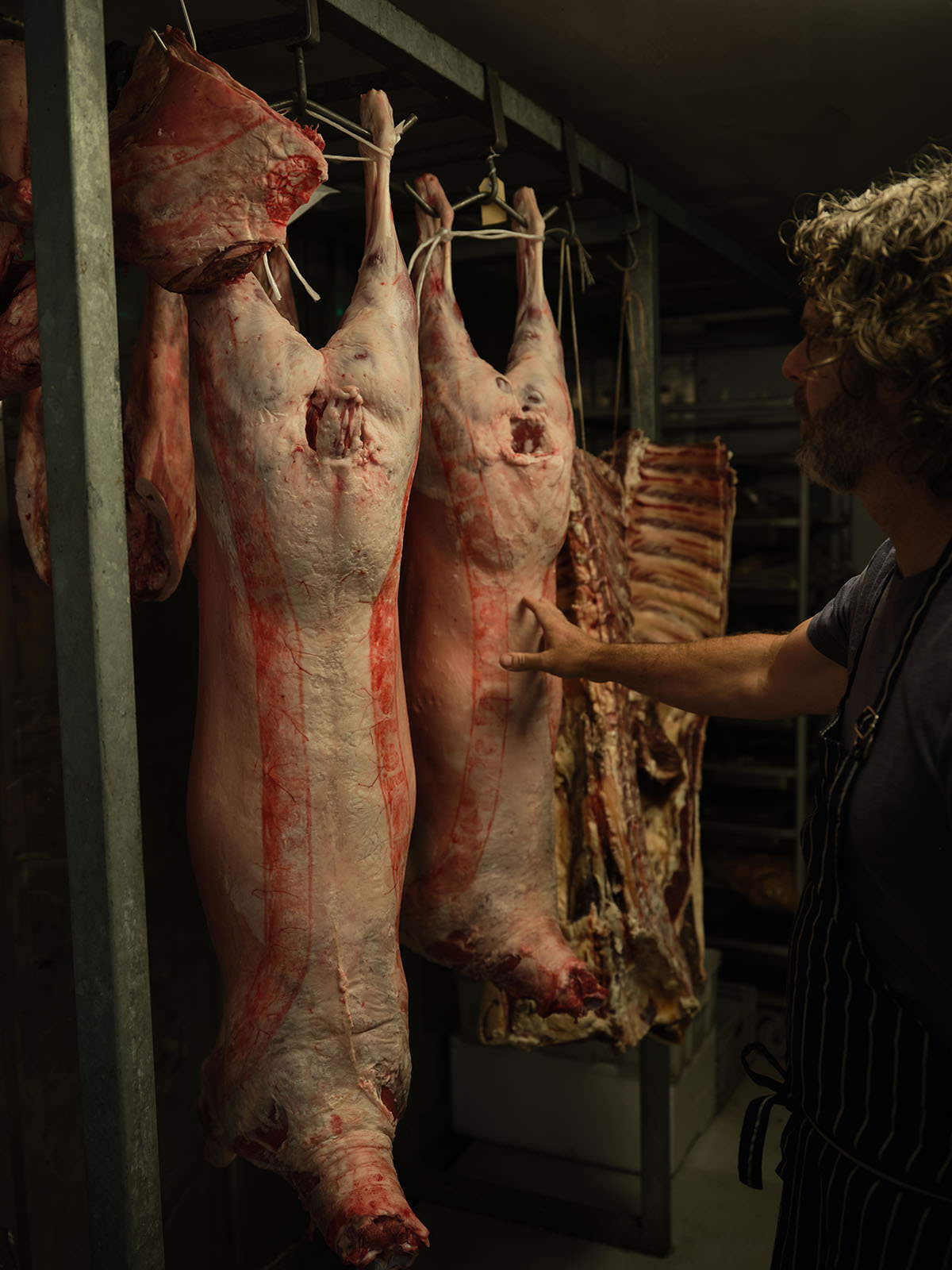 Gippsland lambs hanging in the cool room - Hogget Kitchen has never used boxed meat.