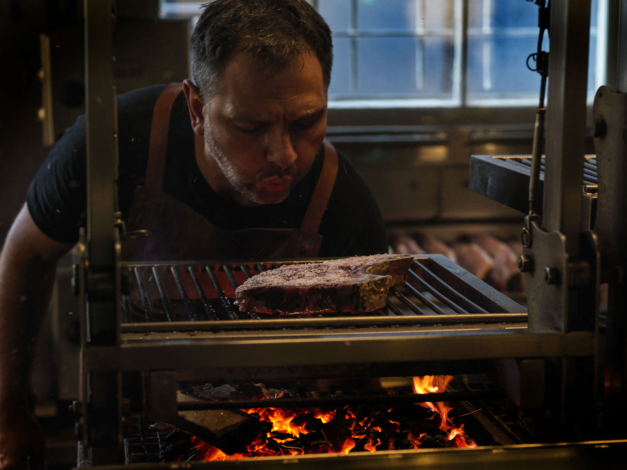 Steaks at Firedoor are cut to order on the bandsaw and grilled over grape vines or spent wine barrels. 