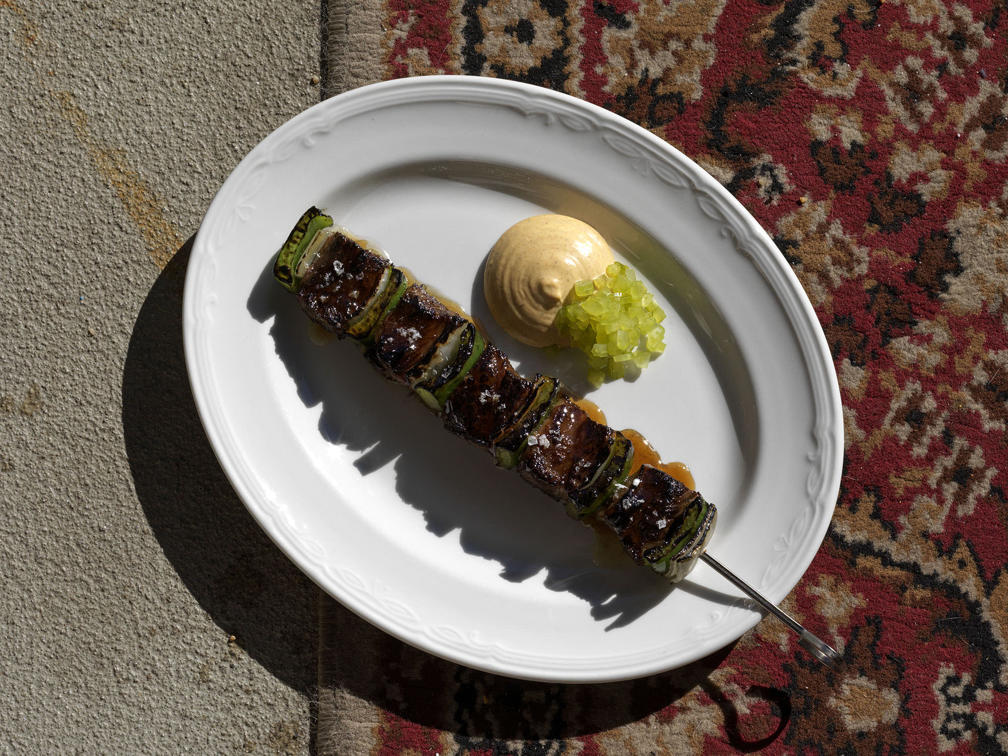 Beef Kebab but make it 9+ full blood wagyu – intercostals are braised for 1.5 hours then skewered and cooked over coals. Served with egg yolk sauce – a hot yolk emulsion with vinegar made from burnt mandarin and saffron, burnt butter and ras el hanout – and celery compressed in the vinegar 4-5 times.