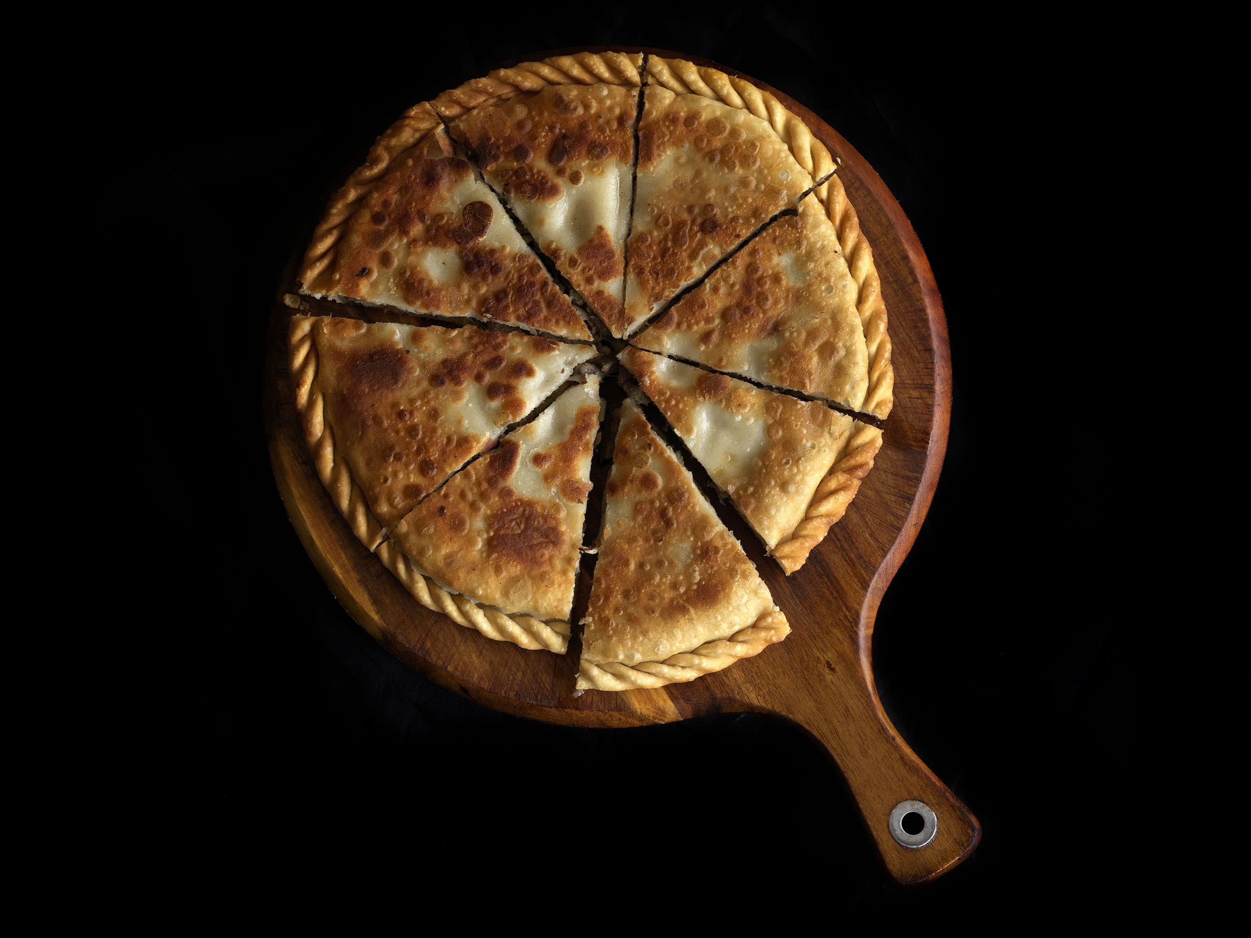 Goshan - Uyghur style meat pie with minced lamb and onion filling seasoned with cumin and a variety of peppers
