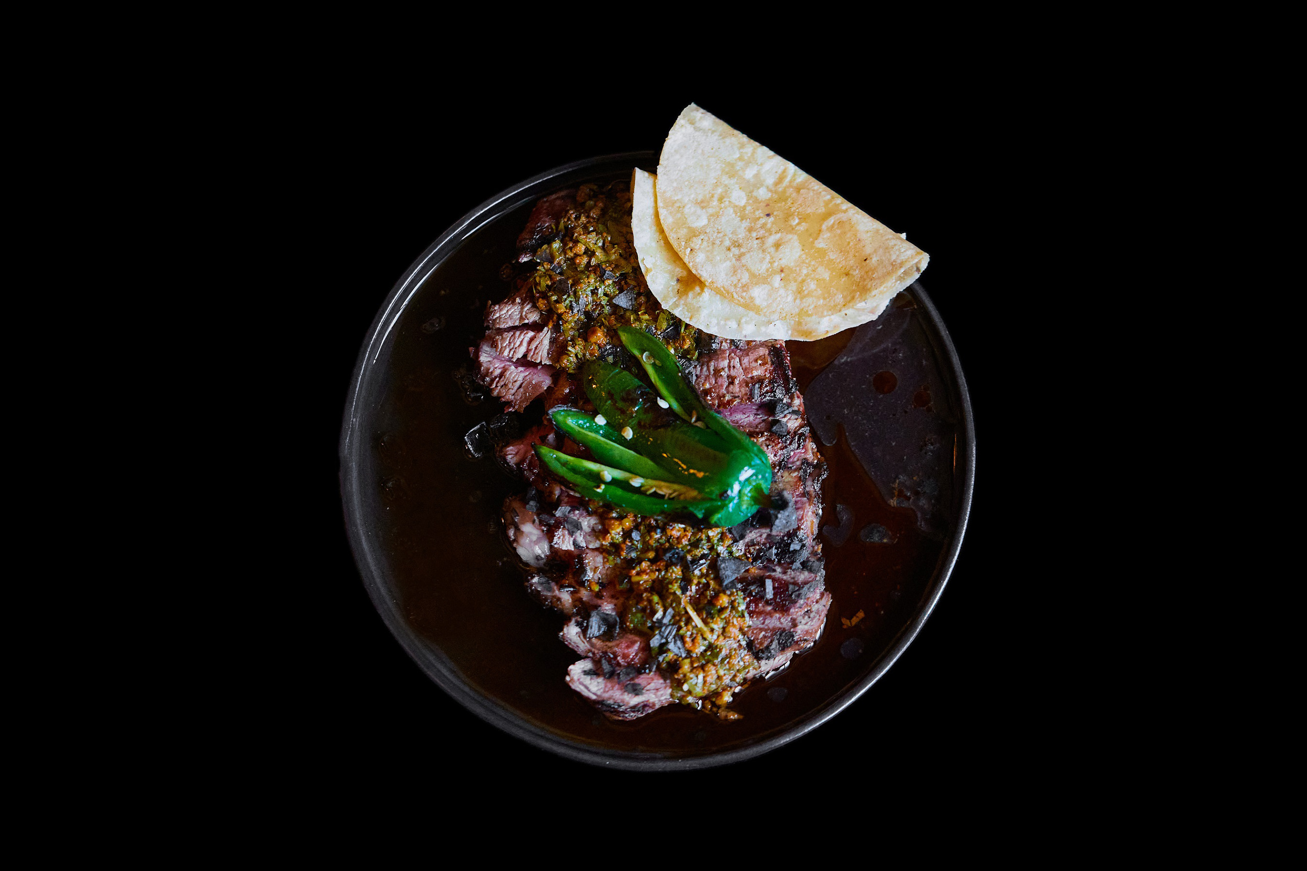 Build-your-own taco – wagyu scotch fillet, chimichurri, smoked paprika, grilled jalapeno and black salt at Carbón.