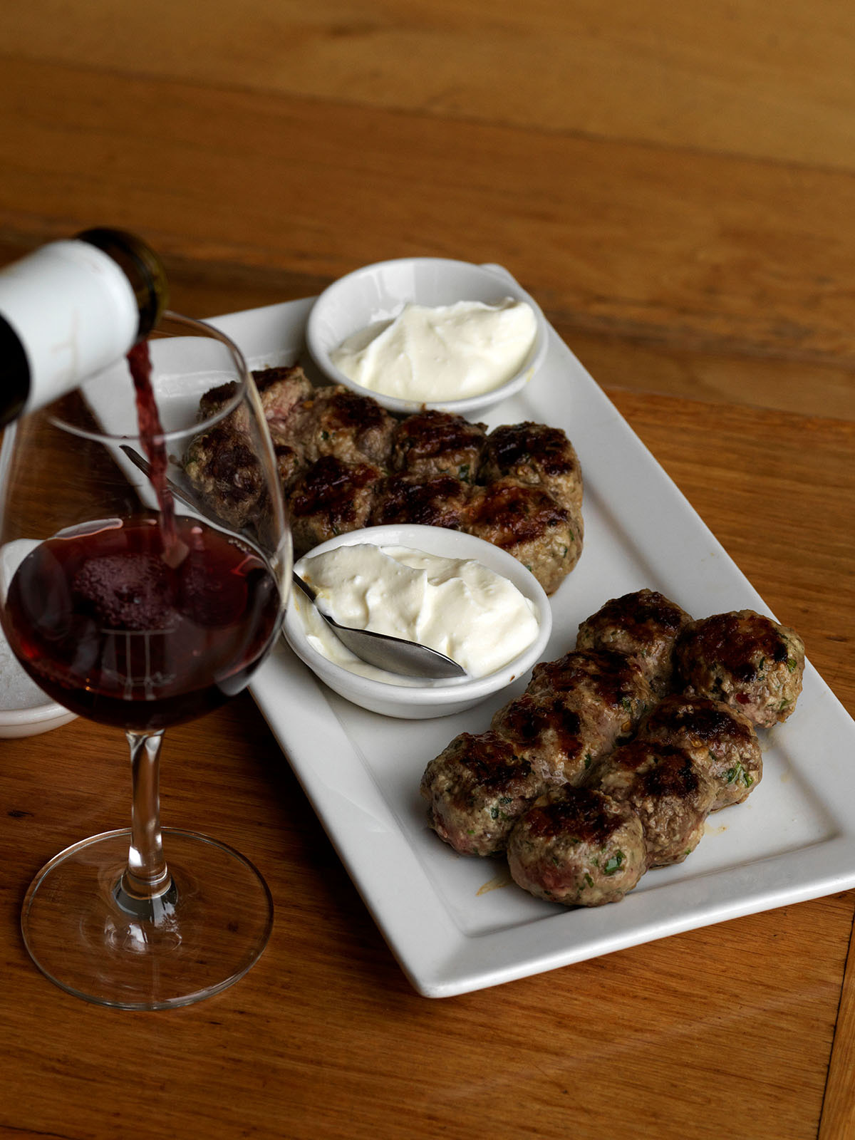 Spicy, juicy meatballs with yoghurt dipping sauce (and wine, of course)